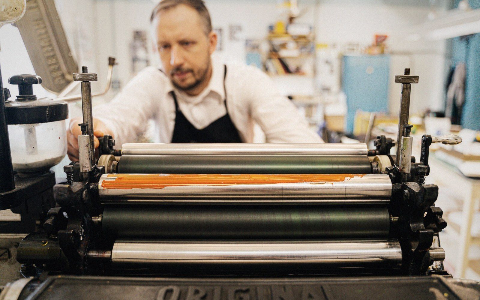 An inked roller on a slab, ink drawn out thin